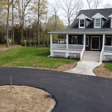 Custom-Circular-Asphalt-Driveway-with-Concrete-Pad-Wall-Township 1